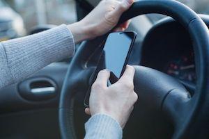 Man texting while driving