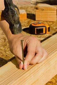 Nail on a piece of wood